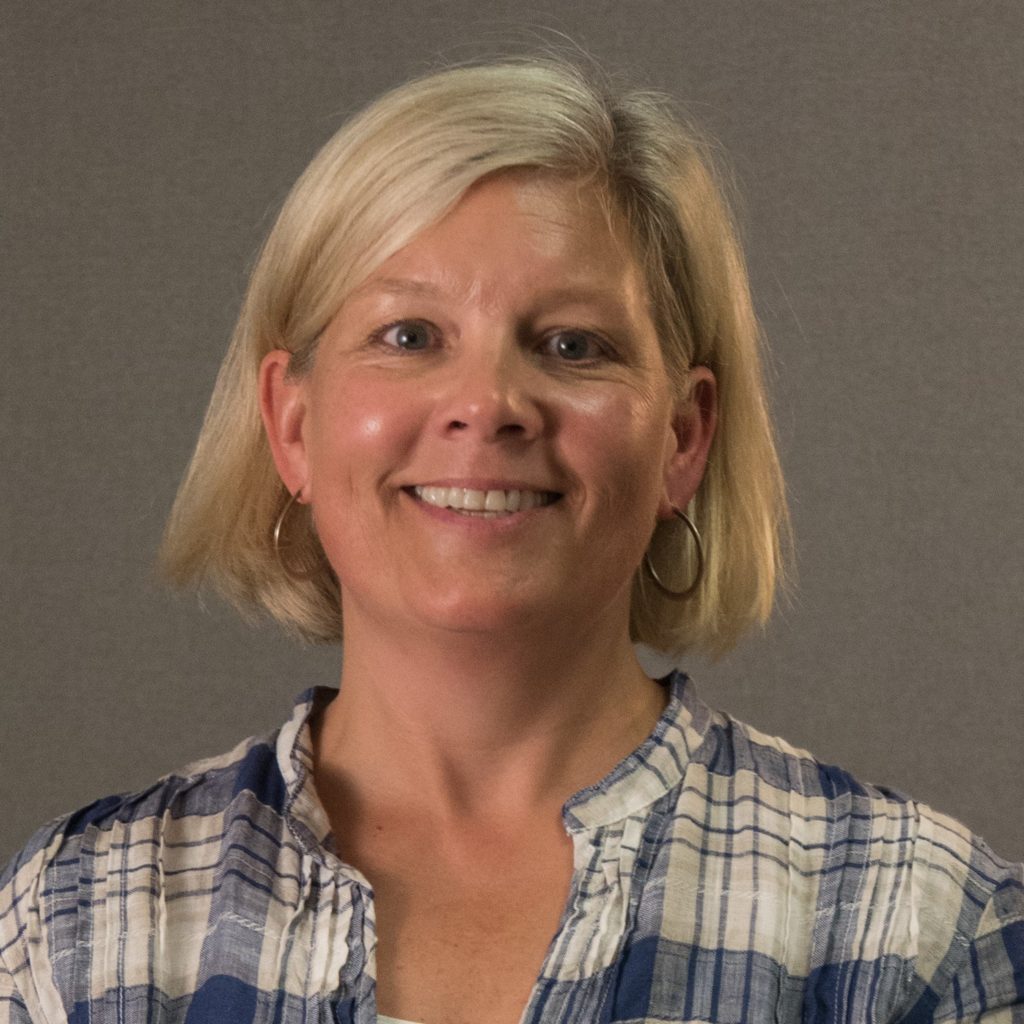 U.S. Godly Play Trainer Sally Thomas in blue plaid shirt